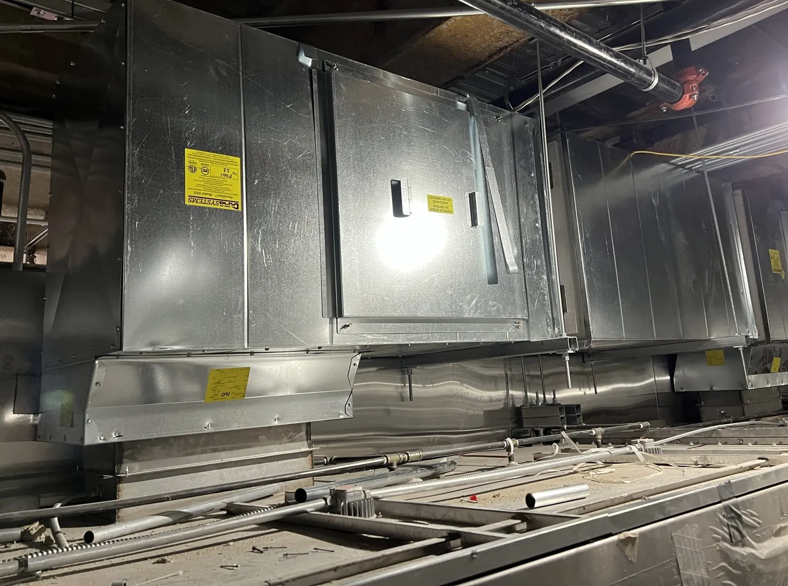 DuraSystems KEX access panel and low-point reservoir, the ‘seesaw’ cleanout that replaces continuous slope.
